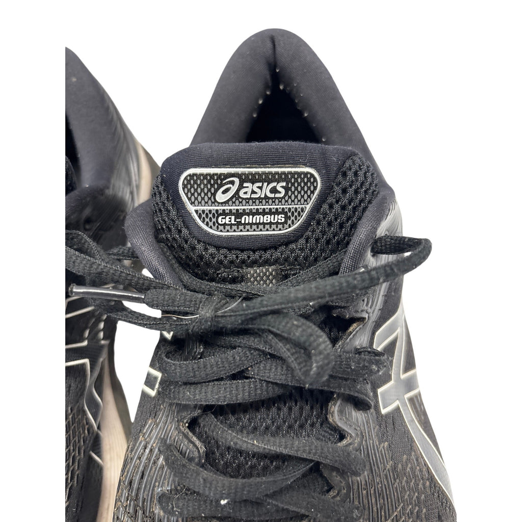 ASICS GEL-Nimbus 21 men’s running shoes in black with white and gray accents.